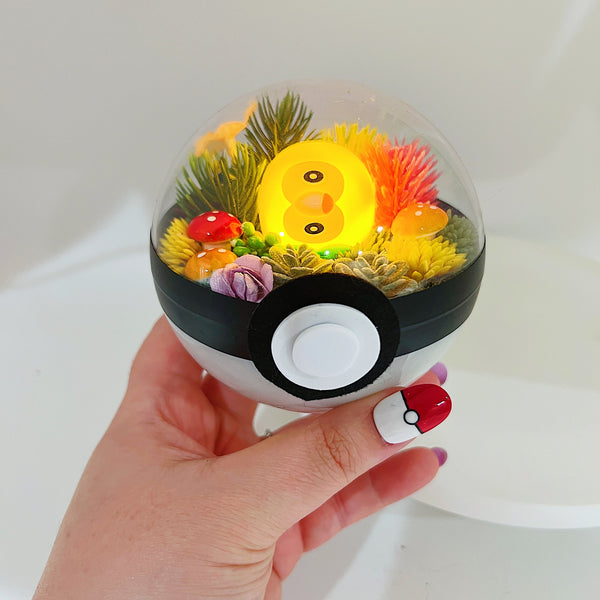LIGHT UP Confused Rowlet Pokeball
